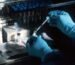 Scientist preparing a biomedical research sample in a laboratory