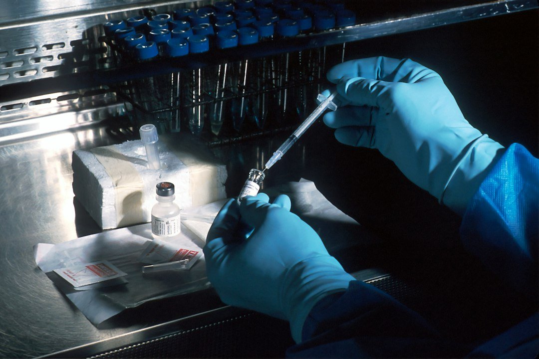 Scientist preparing a biomedical research sample in a laboratory
